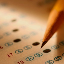 A close up of an answer sheet for a test with a pencil.